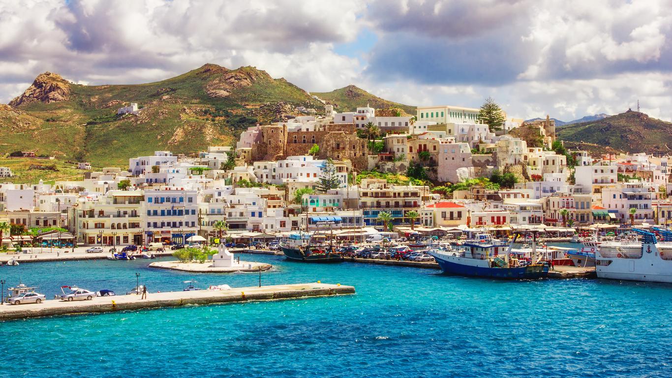 Ferry arriving at Naxos port with the Portara visible on its islet
